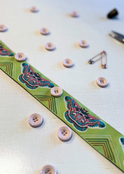 This is a medium soft pink colored button